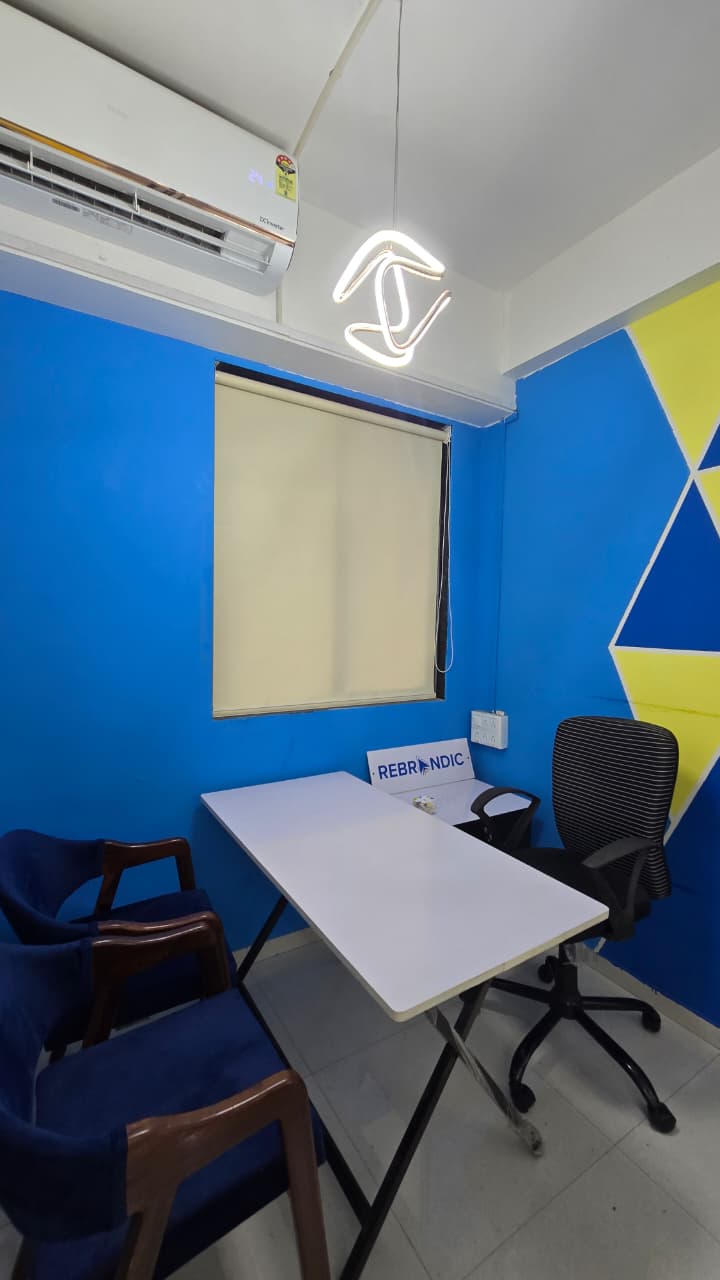 Private cabin with blue walls and designer lighting